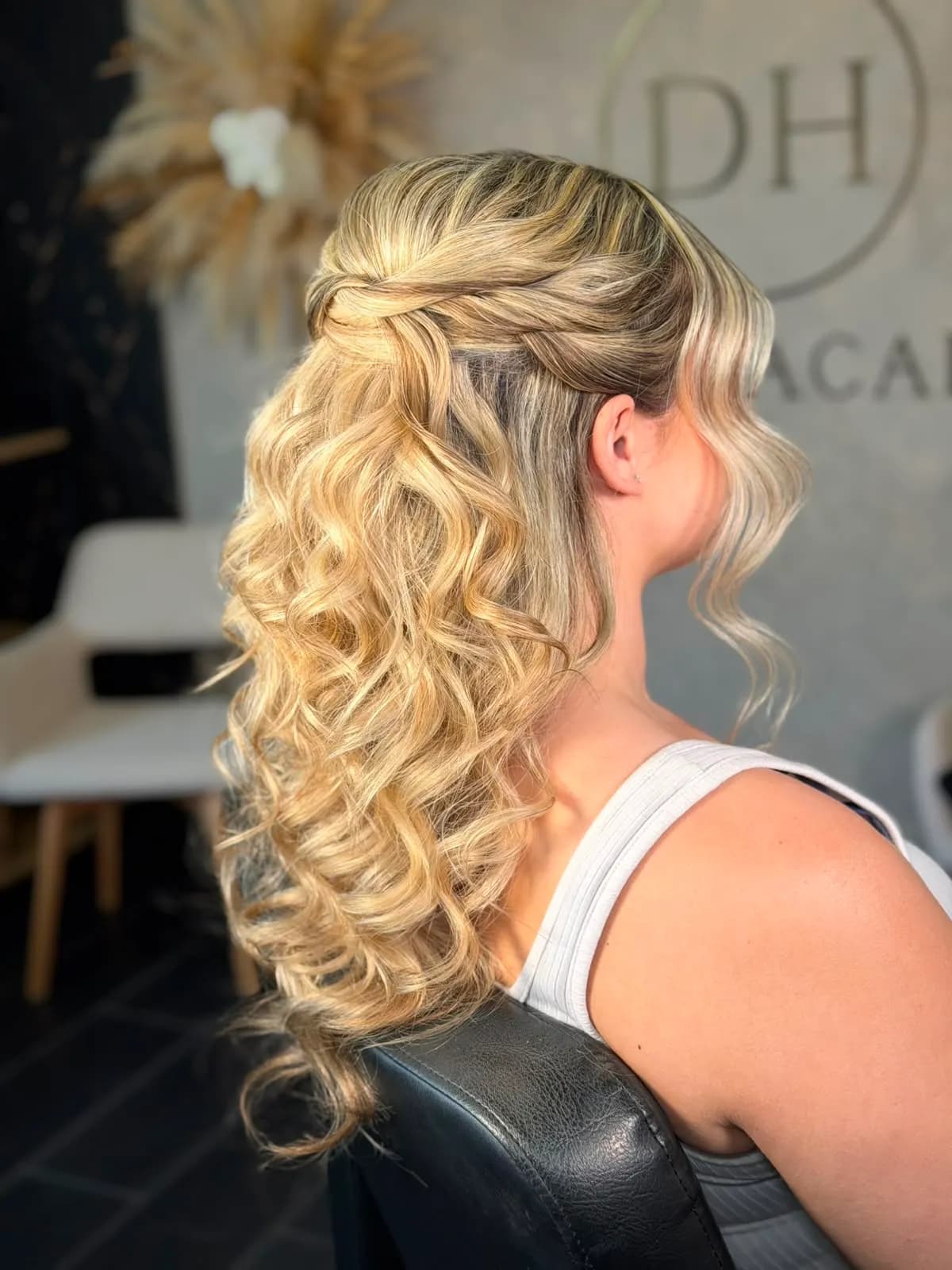 Blonde half-up style with soft curls
