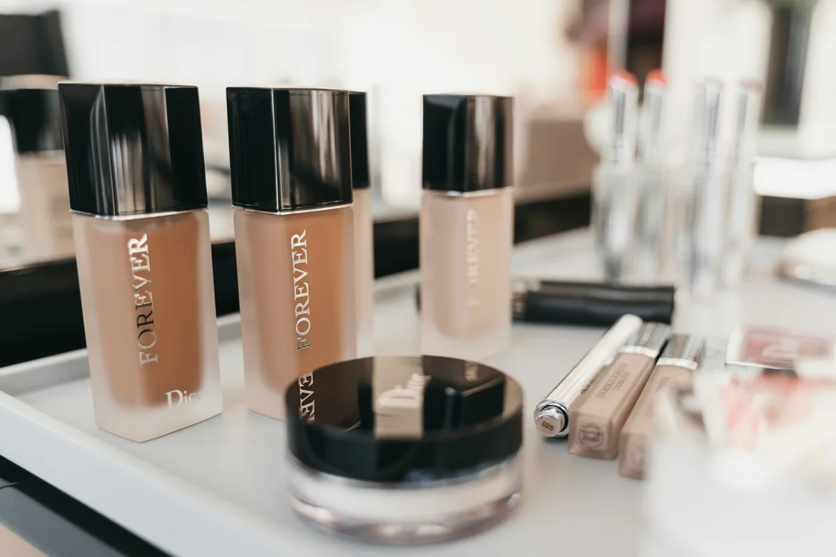 Dior Forever foundations and concealers arranged on a vanity tray