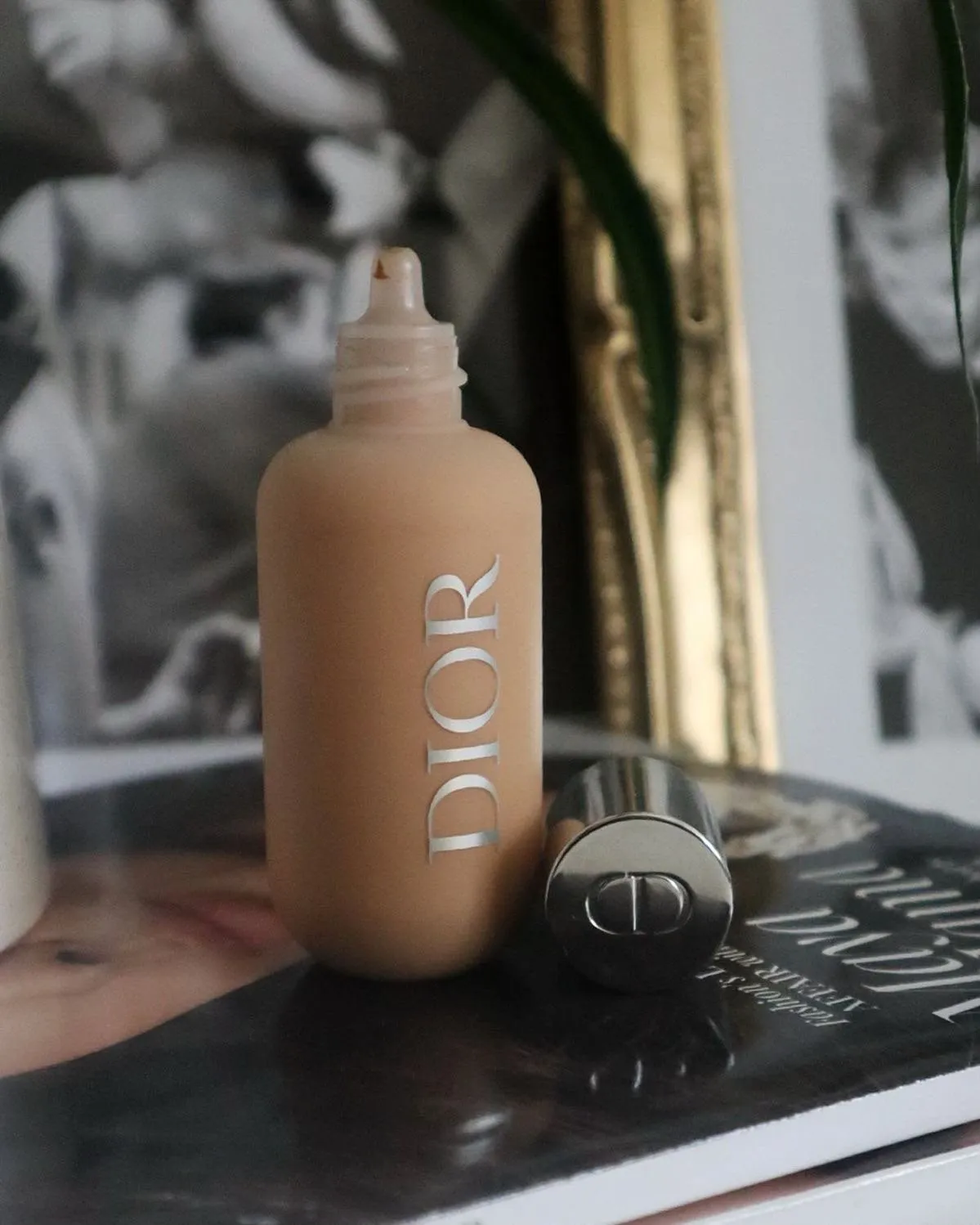 Designer foundation bottle styled on a magazine
